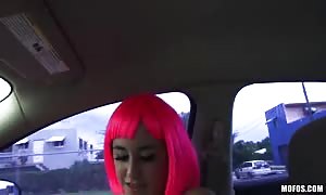 beauty in pink wig having vast
 sex in the car